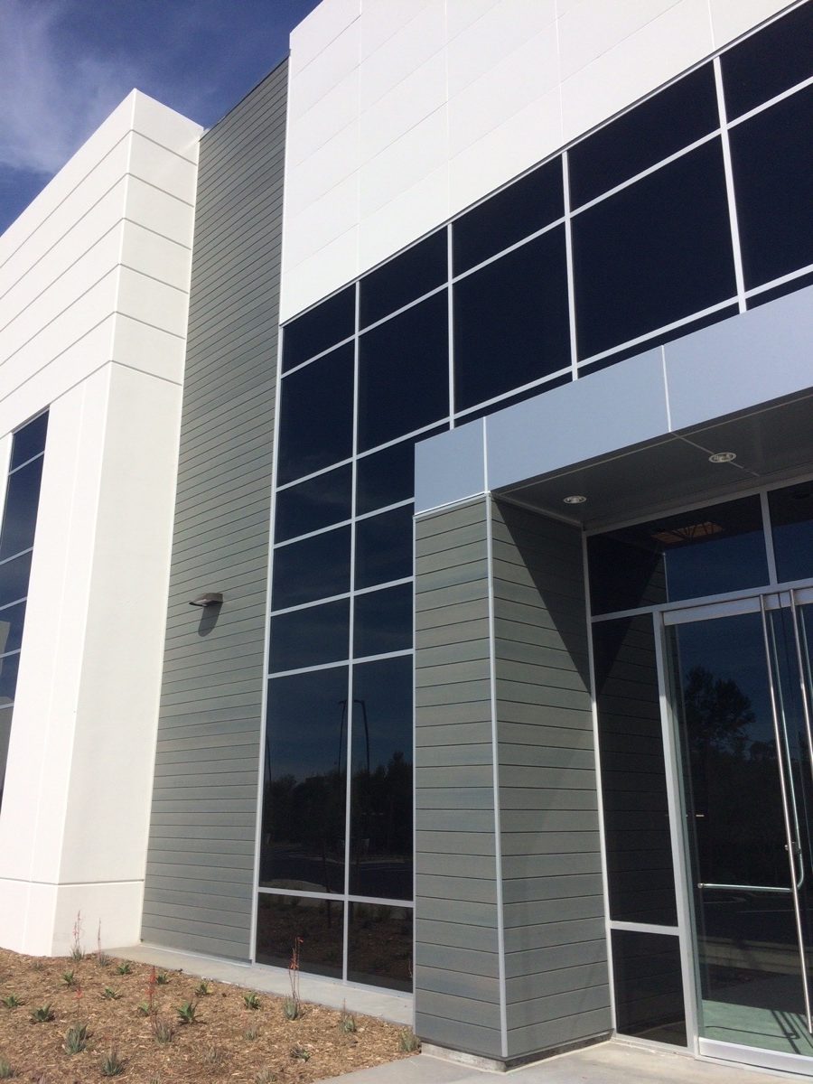 Whiptail Loop, 2069 Entrance, edged by Resysta siding